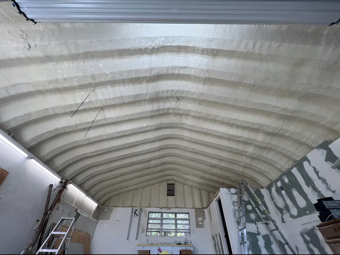 Spray polyurethane foam applied to the underside of a metal roof deck in Gurnee